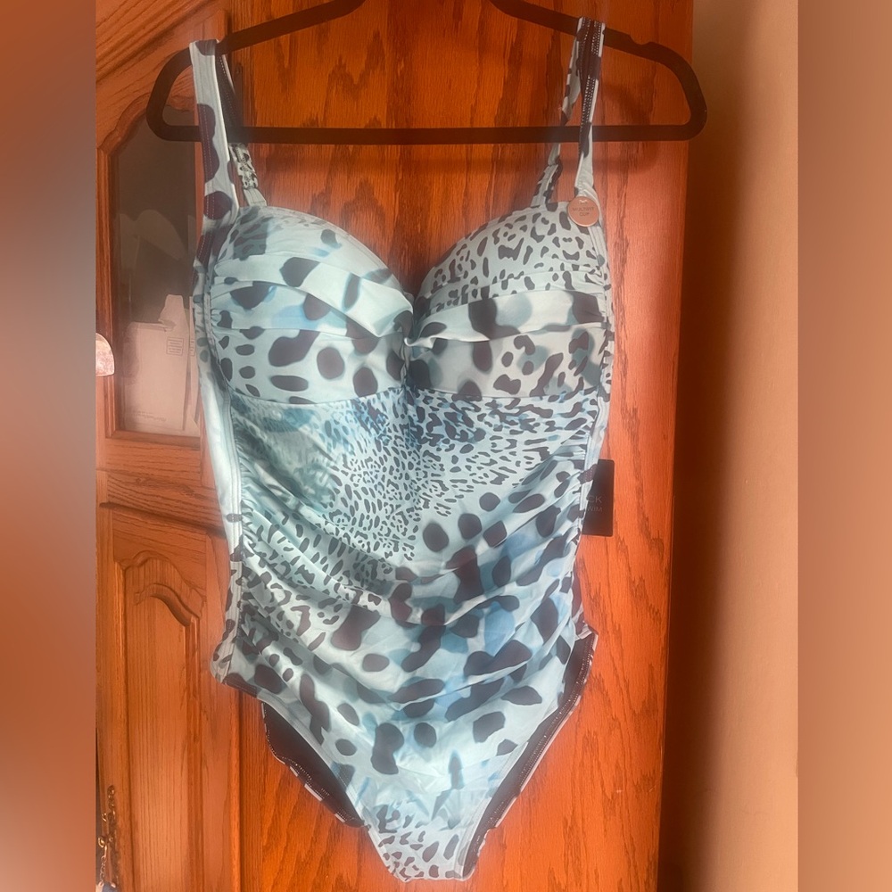 One piece bathing suit. Nip Tuck is an Australian brand. Color is bright blue.